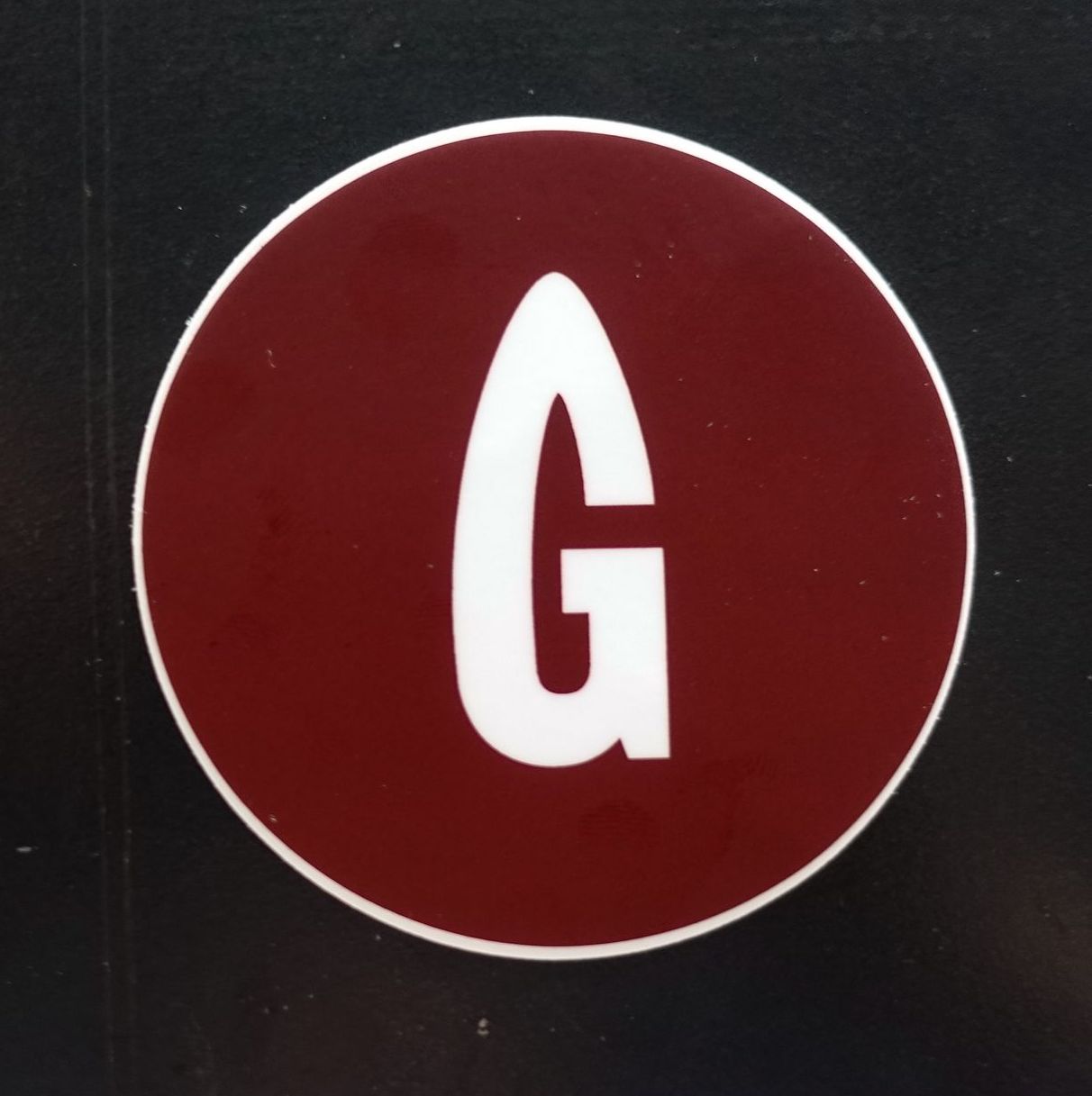 burnt maroon gastro gnome logo sticker