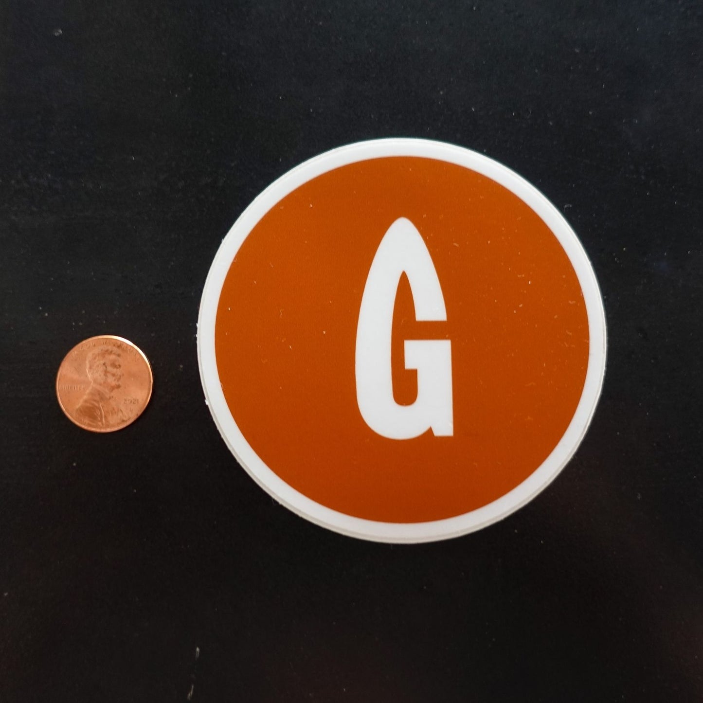 orange gastro gnome logo sticker size comparison